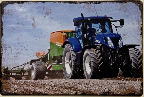 New Holland tractor op land reclamebord van metaal